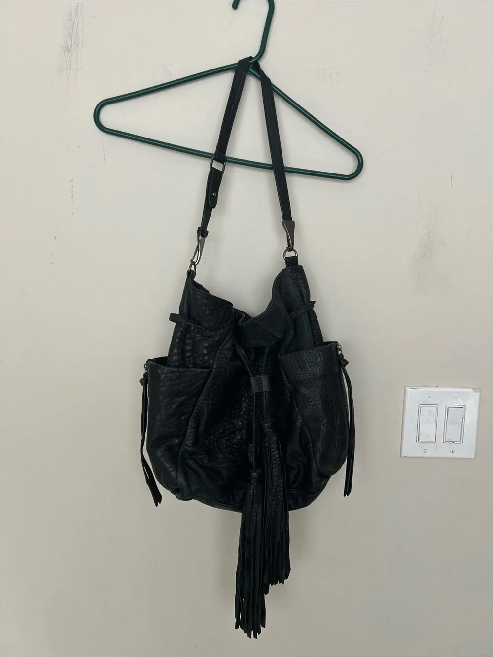 vintage Kooba hobo bag, drawstring closure, fringe tassels, exterior pockets.